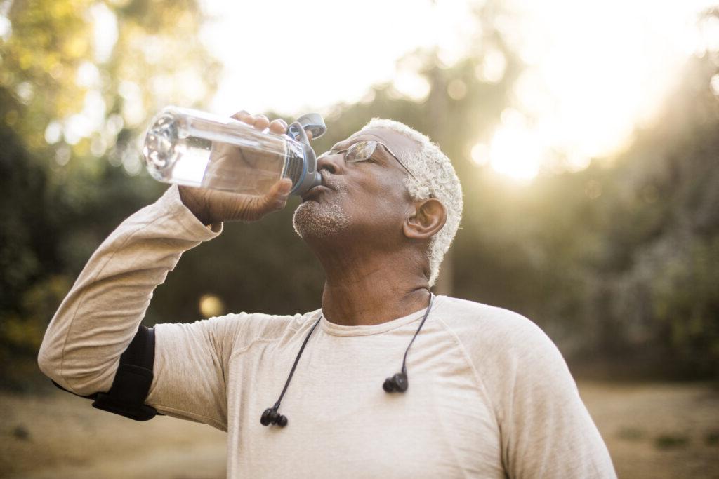 Senior African American Man Drinking Water